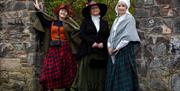 A promotional picture for the guided tour featuring 3 ladies in character dress - Image for promotion purposes only
