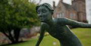 Art & Soul 2025 Sculpture - Lady Bending Forward Smiling