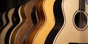 close up of a row of Guitars
