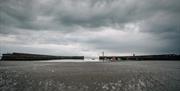 Image of the Donaghadee harbour from the beach during low tide