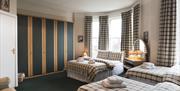 Triple bedroom, one double and two twin beds