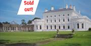 Ballywalter Park house exterior surrounding by greenery, now sold out
