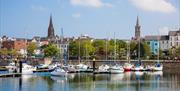 Image of City of Bangor from the Marina with boats in foreground and buildings in background