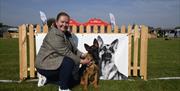 Joanne Westerhouse with her German Shepherd Dog Puppy bitch, Fiadh, just a baby Puppy at the show.