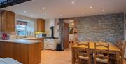 a photo of a dining table and a kitchen