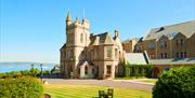 View of the hotel and landscaped grounds on a bright sunny day