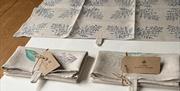 Finished pieces of Linen, hand printed at Linen Schoolhouse