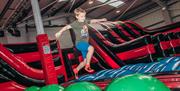 Boy Bouncing in the Airtastic Inflata Park