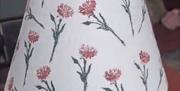 A linen block printed lampshade
