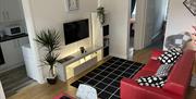 The Living room is through the front door immediate left is the kitchen - no door
To the right is the kitchen table and 4 chairs behind which is the r