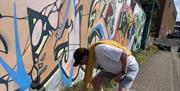Member of the tour doing their own tag