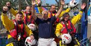 The local RNLI team enjoying a ride on the Panoramic Wheel in Bangor