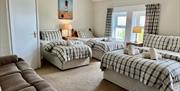 Triple bedroom, one double and two twin beds