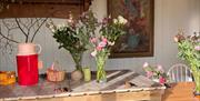 Table with vases of flowers