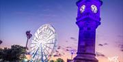 The Panoramic Wheel at dusk with McKee Clock in Bangor