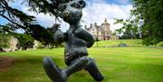 Lost in Reverie Bear bronze sculpture by Patrick O'Reilly in the grounds of the Culloden Estate & Spa