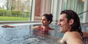 A couple enjoying the waters in the spa
