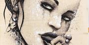 Close up image of one of artist Terry Bradley's stunning  paintings, this one is of a woman's face in black and white