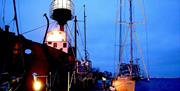 The Lightship lit in the evening