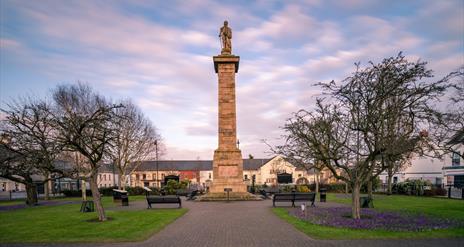 a photo of a monument in the square in comber