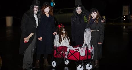 a photo of 5 people dressed up in halloween costumes