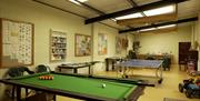 a photo of a snooker table of a games room