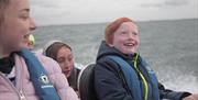 Children smiling on boat