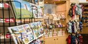 A photo of inside the Visitor Information Centre showcasing the shop which sells locally made gifts and souvenirs
