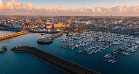an aerial photo of bangor marina with the town in the background