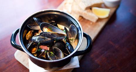 A main meal, mussels with bread