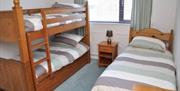 Triple bedroom, a single bed and bunks