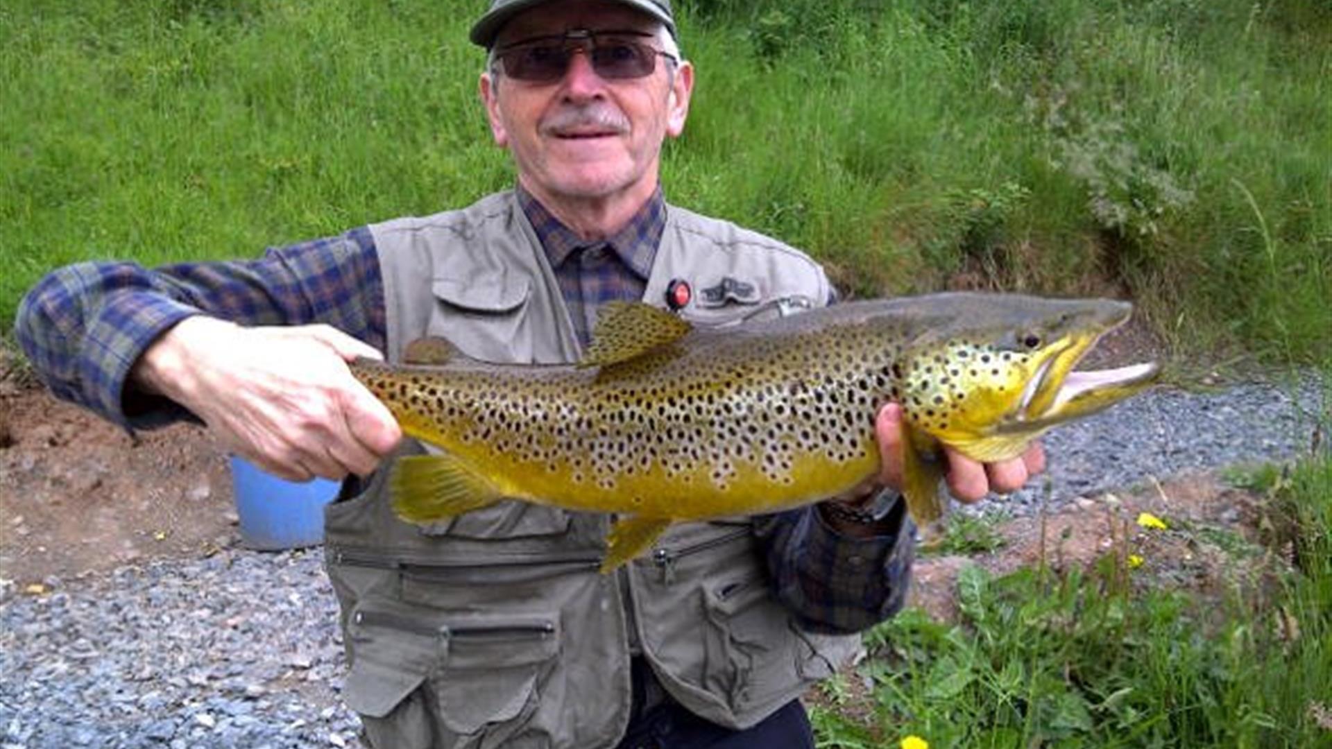 Genteman holding a large fish