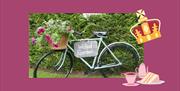 Decorative bicycle with flower basket and sign hanging off it with the words 'Walled Garden'