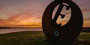 Sunset at Burr Point Ballyhalbert, E sculpture marking the most easterly point on the Island.