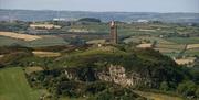 Drone photo of Scrabo Tower sitting majestically on it's hill overlooking countryside
