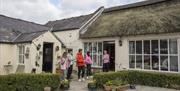 Tracey and guests in the external courtyard of the Farmhouse
