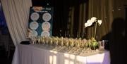 Filled champagne flutes on a table