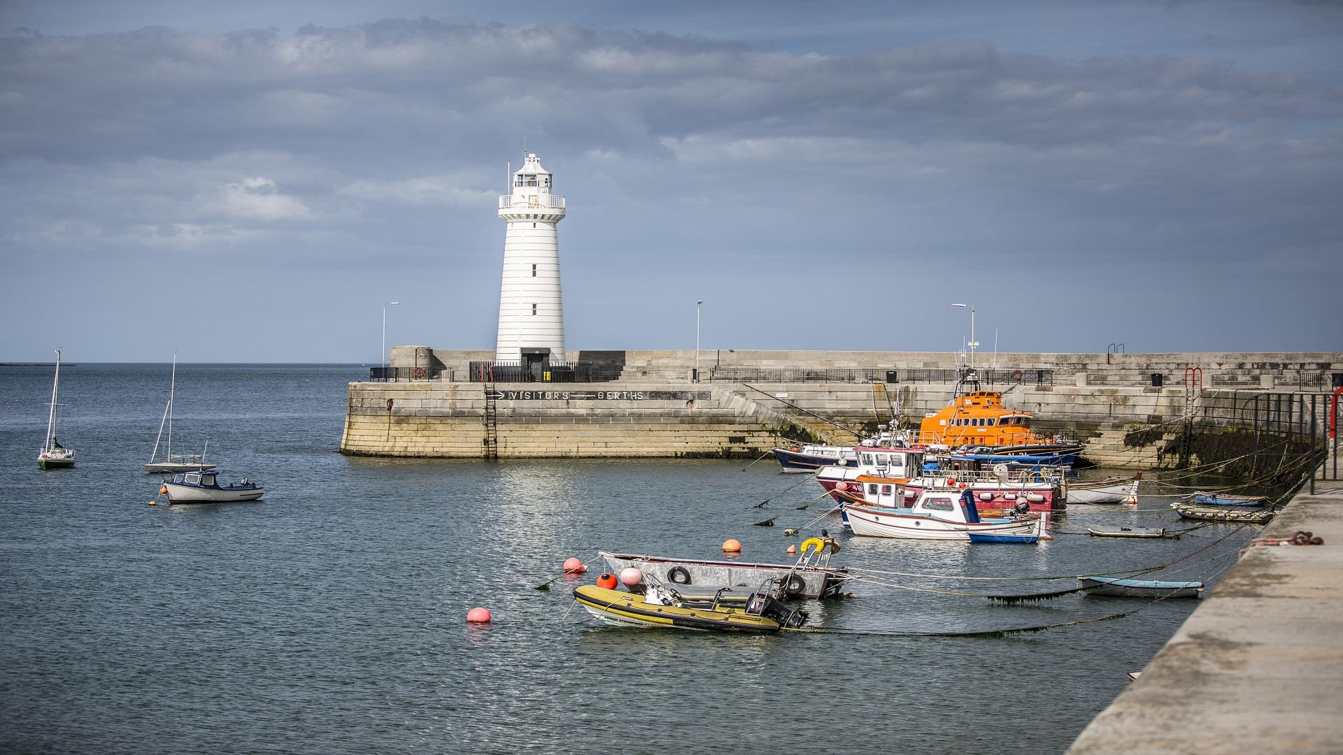 Image of Donaghadee lighthouse and boats tied in the harbour