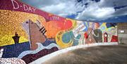 Image of the mosaic mural on the wall at the end of Eisenhower Pier which depicts the boroughs role in WWII