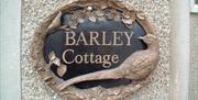 a photo of a sign saying barley cottage