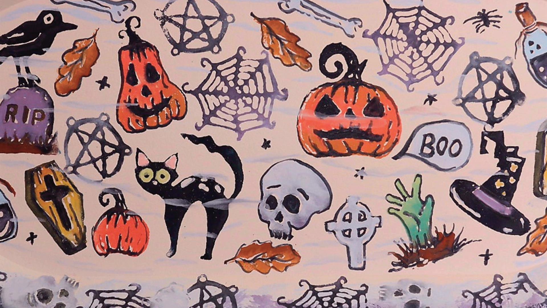 Pottery plate decorated with Halloween themed prints Pottery plate decorated with Halloween themed prints