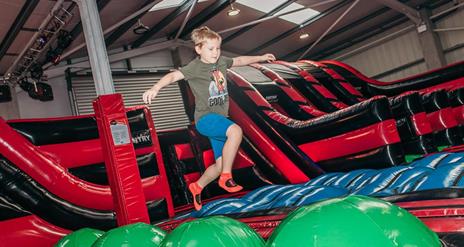 Boy Bouncing in the Airtastic Inflata Park