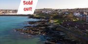Birds eye view of Pickie towards Coastal Path with sold out note