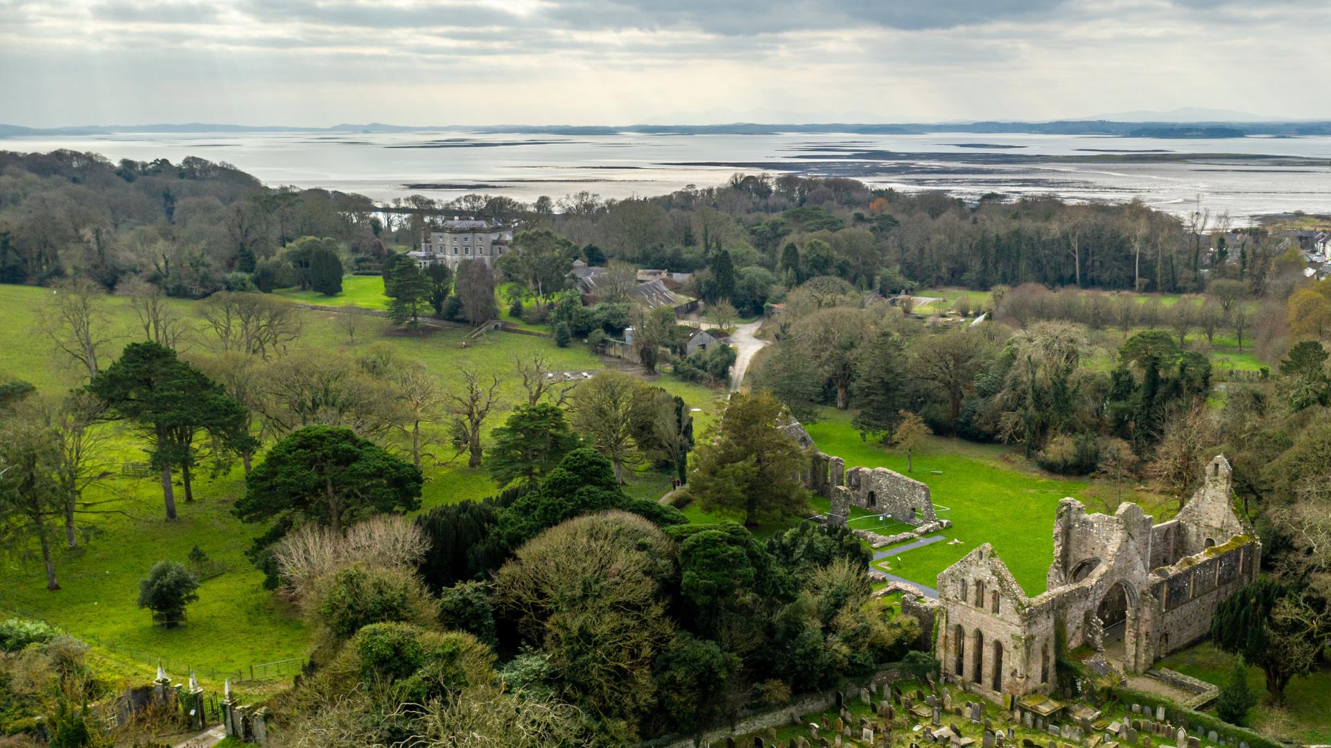 Birds eye view of Grey Abbey in Greyabbey with Strangford Lough in the background.