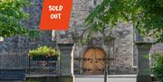 A picture of Newtownards Priory with the text saying Sold Out
