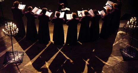 a photo of a choir using sheet music