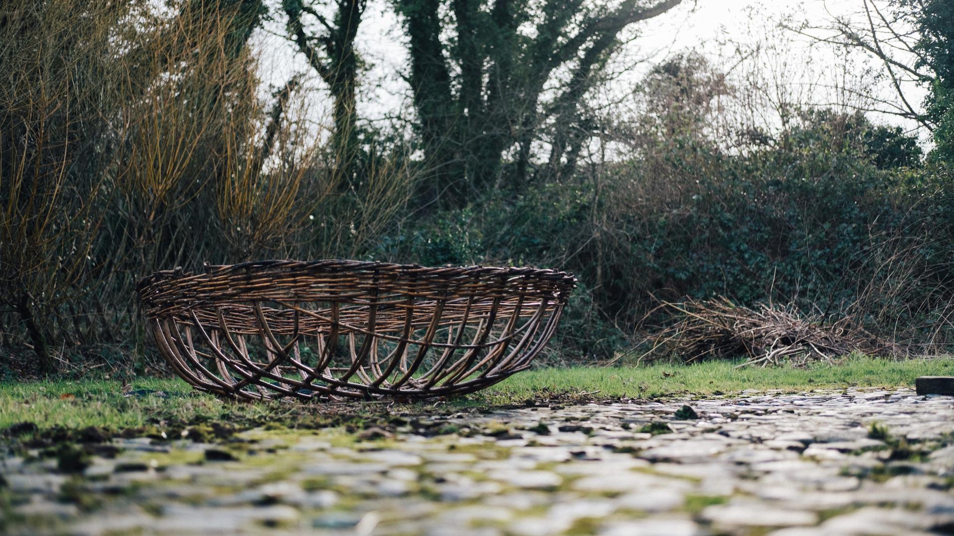 a wicker basket on the ground at ulster folk museum