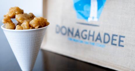 Cone of scampi and Donaghadee branded canvas bag